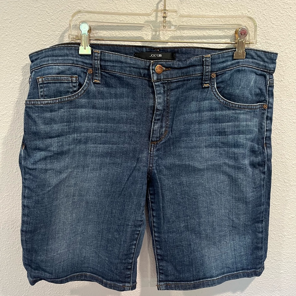 Joes blue jean shorts. Above the knee.